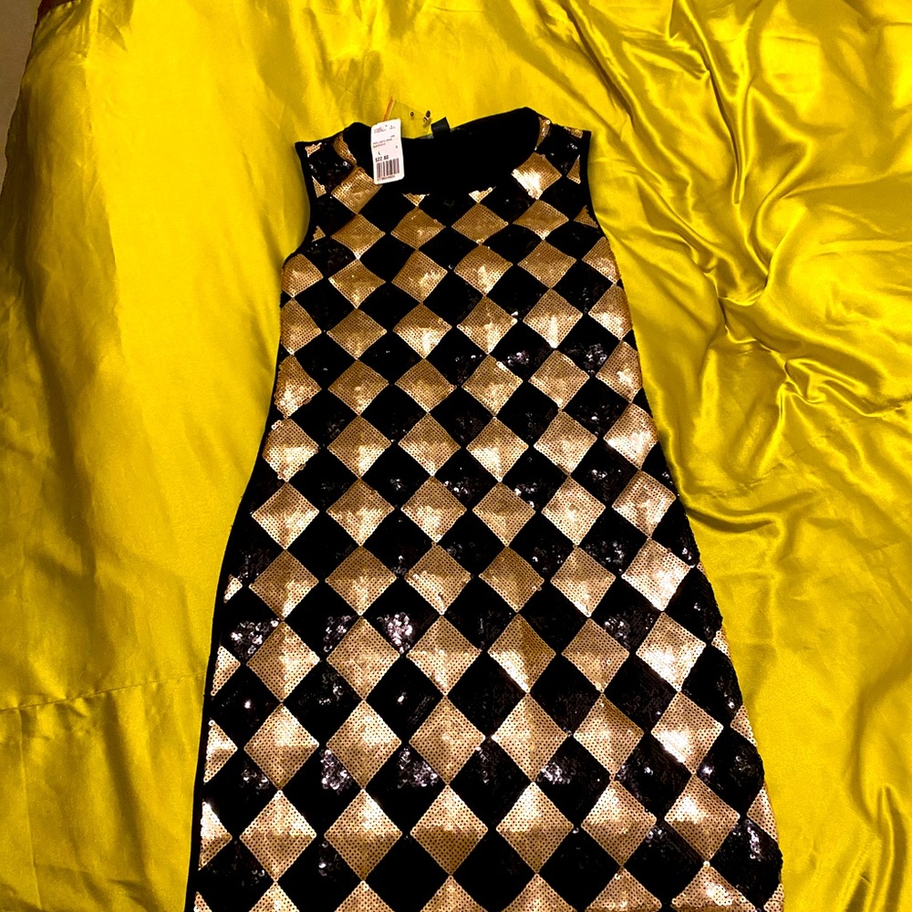 Black gold sequined mini dress .